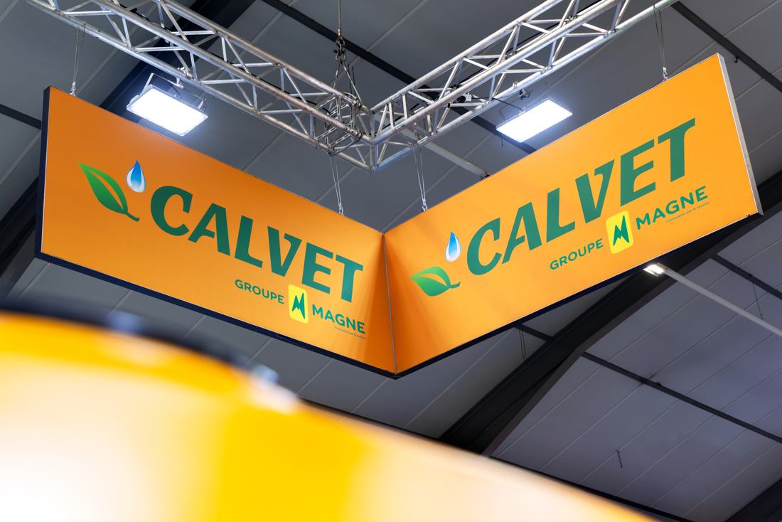 Calvet stand with orange hanging signage